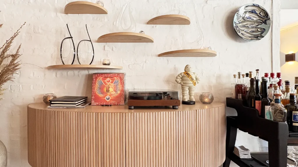 Jordnær restaurant interior with Michelin figurine record player and bar at Odette Odyssey