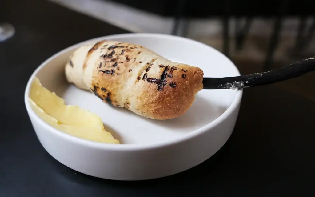 Classic campfire bread grilled over open flame served with rich cultured Danish butter