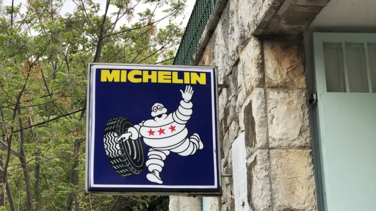 We Wanted the Chef. We Got the Brand. – Old Michelin sign with the Michelin Man rolling a tyre, three red stars on his belly, Valldemossa, Mallorca.