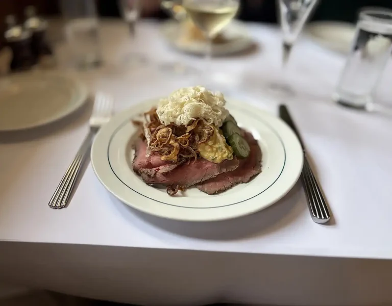 Roast beef smørrebrød with remoulade, horseradish, cucumber salad and crispy onions at Restaurant Schønnemann in Copenhagen, Denmark