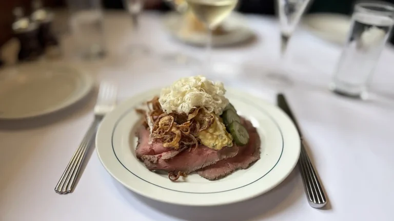 Roast beef smørrebrød with remoulade, horseradish, cucumber salad and crispy onions at Restaurant Schønnemann in Copenhagen