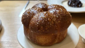 Review: The Black Swan at Oldstead – Bread served at Roots in York, presented on a wooden board.