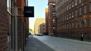 The Spärrows Manchester: How Wrong We Were – Erst restaurant sign on a cobbled street in Ancoats, Manchester