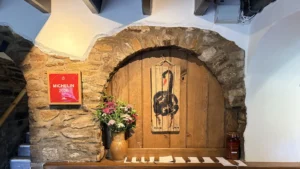 Review: SOURCE at Gilpin Hotel, Windermere – Reception at The Black Swan at Oldstead with Michelin 2026 plaque and painted swan sign